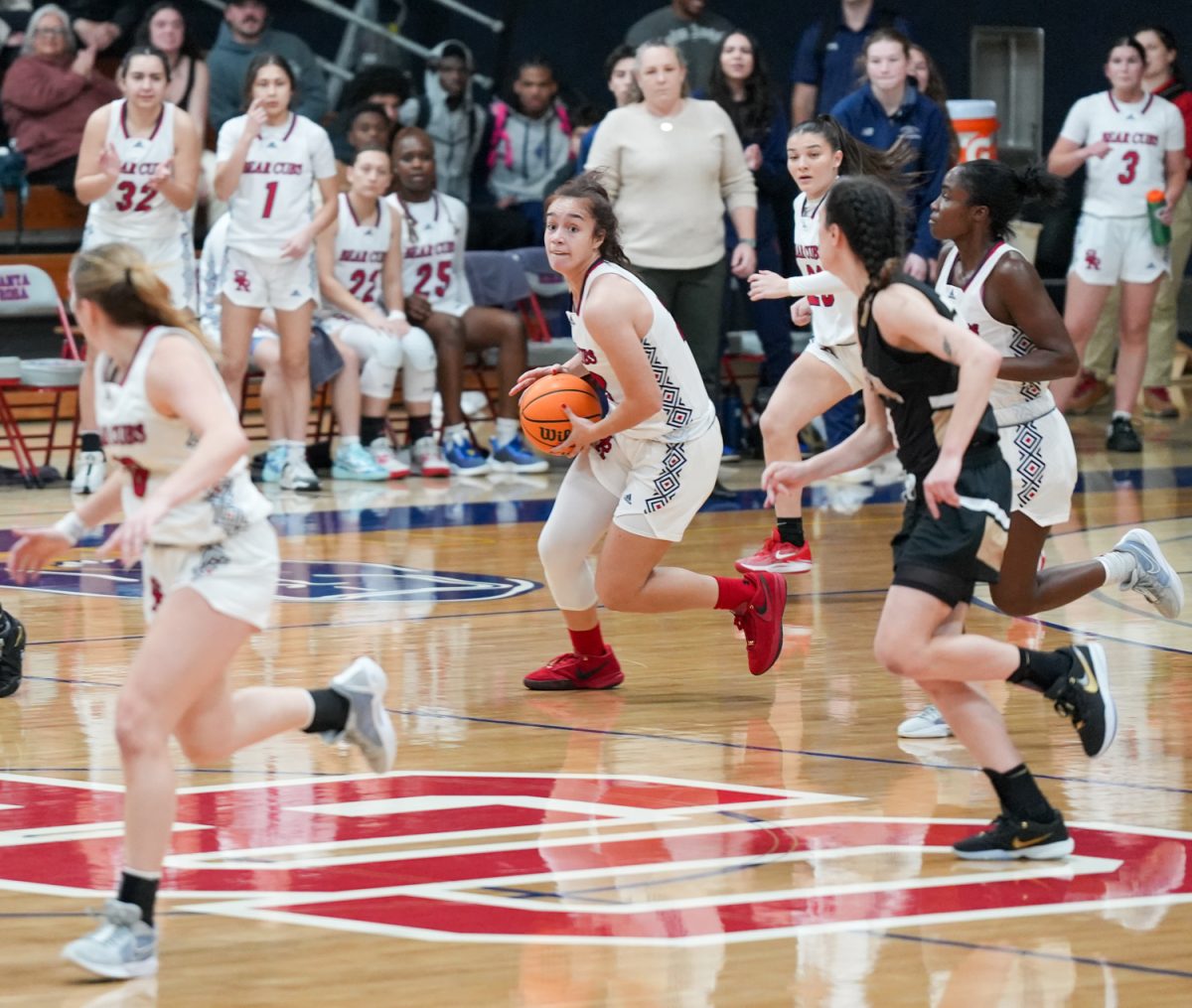 SRJC forward Ivy Gonzalez looks to pass the ball up court to teammate Lucca Lowenberg at Santa Rosa’s Haehl Pavilion Feb. 2, 2024