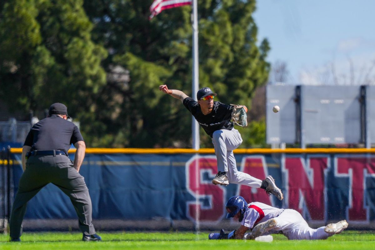 Shortstop Aidan Lombardi slides safely to second aginst Cosumnes River on Tuesday, March 26, 2024.