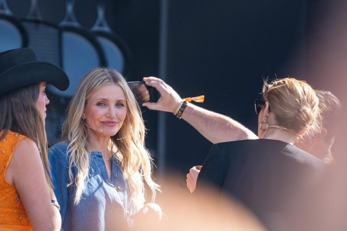 Cameron Diaz prepares to take a selfie at the Williams Sonoma Culinary Stage on the first day of Bottlerock in Napa on Friday, May 24, 2024.
