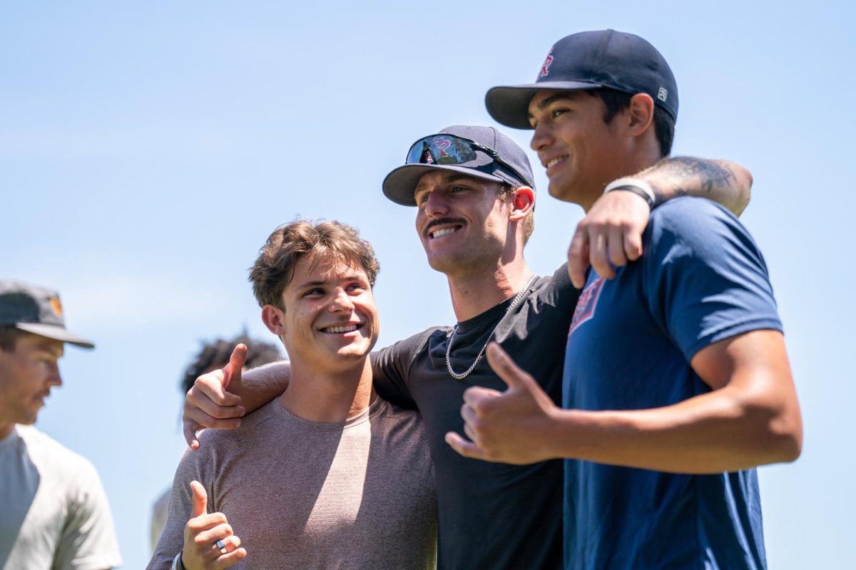 (Left to right) Alex Leopard, Jake McCoy, and Hekili Robello are all smiles after their last team meeting of the 2023-2024 baseball season on Tuesday, May 14, 2024 in Santa Rosa.