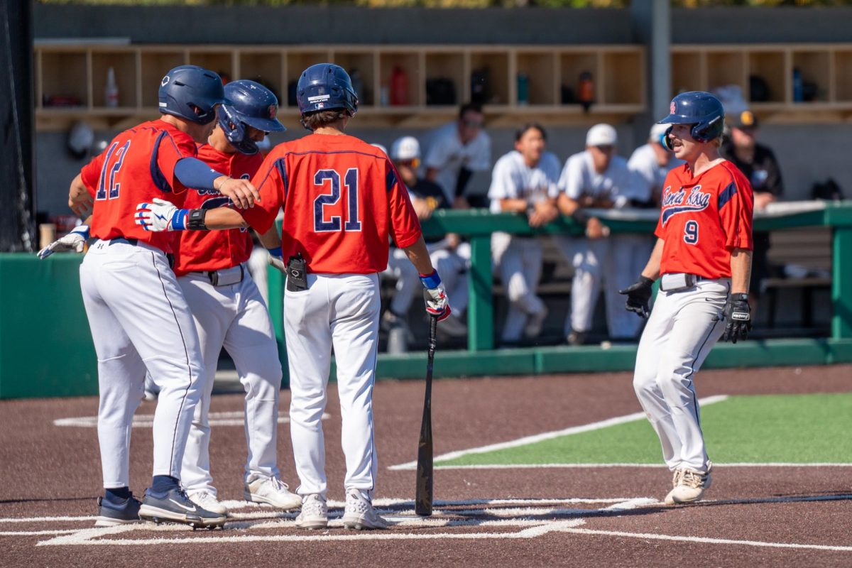 Third baseman Keenan Morris is greeted by other members of the team after his home run in the bottom of the fifth against Chabot College in the second round of the CCCAA Super Regionals in Hayward on Thursday, May 9, 2024.