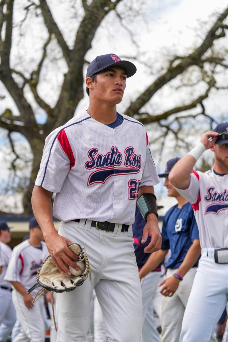 Pitcher Hekili Robello stoically walks out to the mound ahead of his start against Sierra College at Santa Rosa’s Cook Sypher Field, Thursday, March 21, 2024.