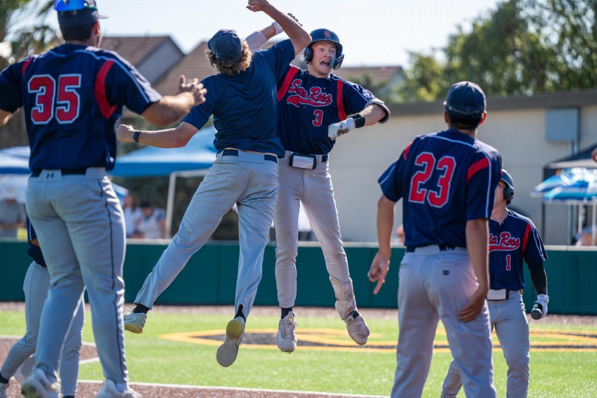 Shortstop Aidan Lombardi, right, leaps up to celebrate with freshman Brett Neidlinger after his three-run home run in the top of the eighth against Cabrillo College in the final round of the CCCAA Super Regionals in Hayward on Friday, May 10, 2024.