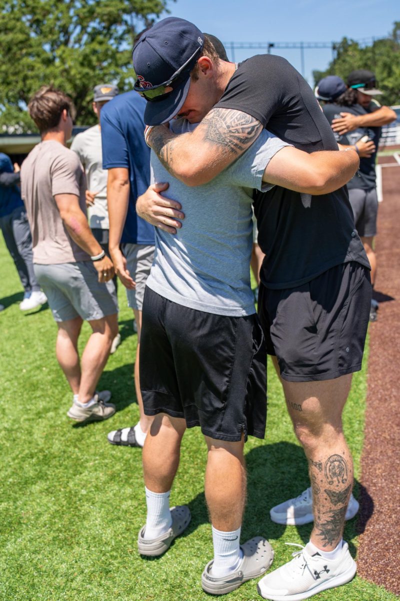 Jake McCoy, right, and Jacob Greiner say their goodbyes during the final meeting of the season on Tuesday, May 14, 2024.