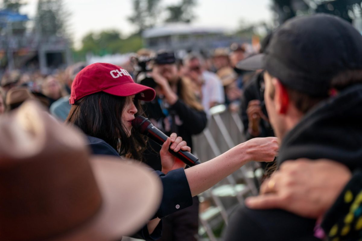St. Vincent steals a fans Chico hat after running down the sound booth walkway at the JaM Cellars Stage at BottleRock Napa Valley on Friday, May 24, 2024.