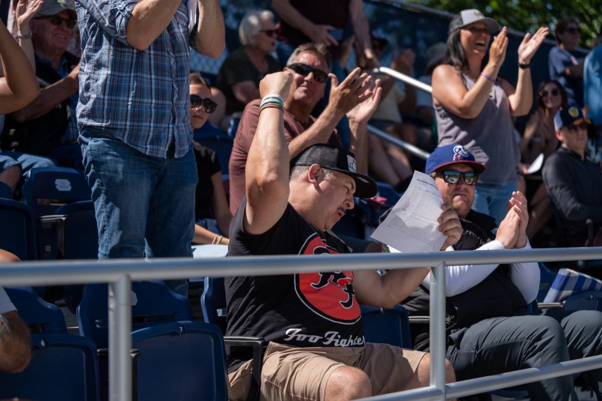 A fan whoops with excitement after Morris grand slam in the bottom of the fourth against College of San Mateo in game 1 of the CCCAA Regional Playoffs at home on Thursday, May 2, 2024.