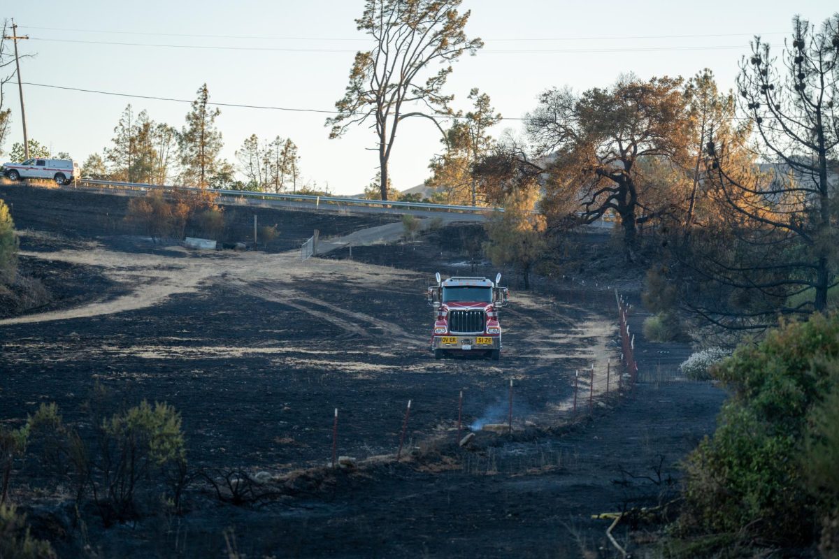 A semihauler is parked in a burnt patch of land off of Skaggs Springs Road during the Point Fire on Sunday, June 16, 2024.