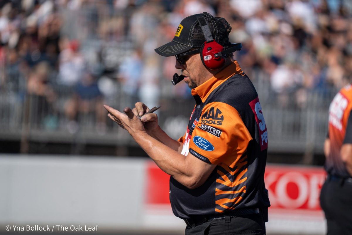A crew member is seen making notes of their track analysis at the DENSO NHRA Sonoma Nationals on Friday, July 26, 2024 in Sonoma.