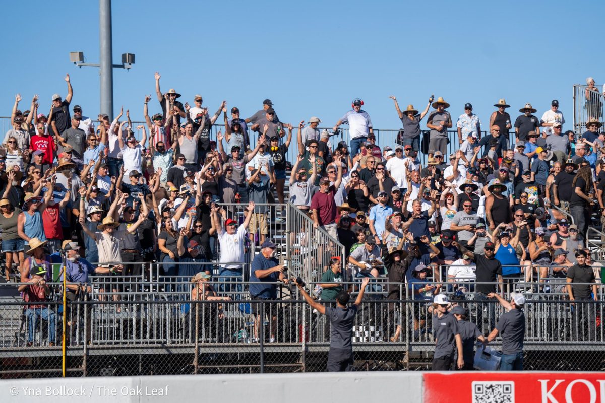 The grandstand roars as team members begin lobbing shirts into the crowd at the DENSO NHRA Sonoma Nationals on Friday, July 26, 2024 in Sonoma.