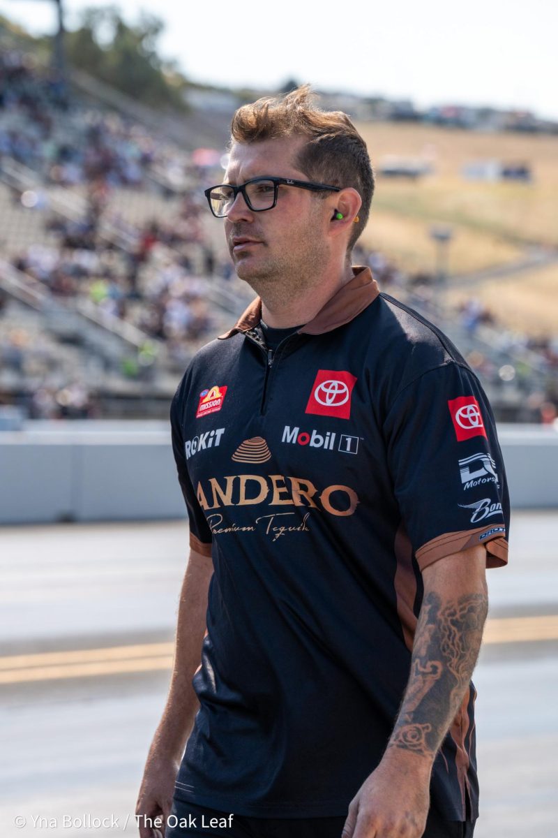 A member of the Bandero pit crew waits for Alexis DeJoria prior to beginning her run at the DENSO NHRA Sonoma Nationals on Saturday, July 27, 2024 in Sonoma. 