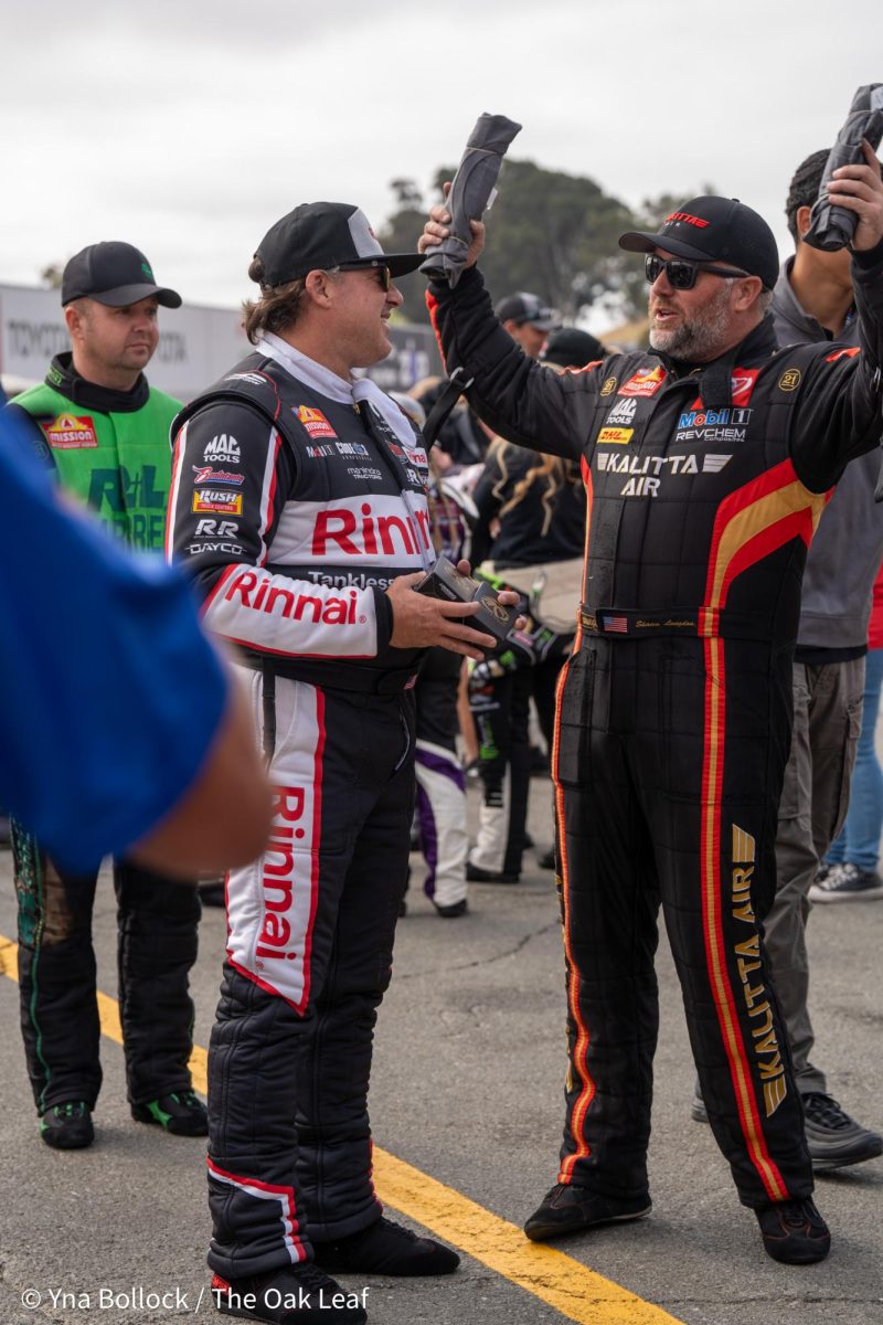 Top Fuel drivers Tony "Smoke" Stewart and Shawn Langdon get ready to enter the stage for driver introductions at the DENSO NHRA Sonoma Nationals on Sunday, July 28, 2024 in Sonoma. 