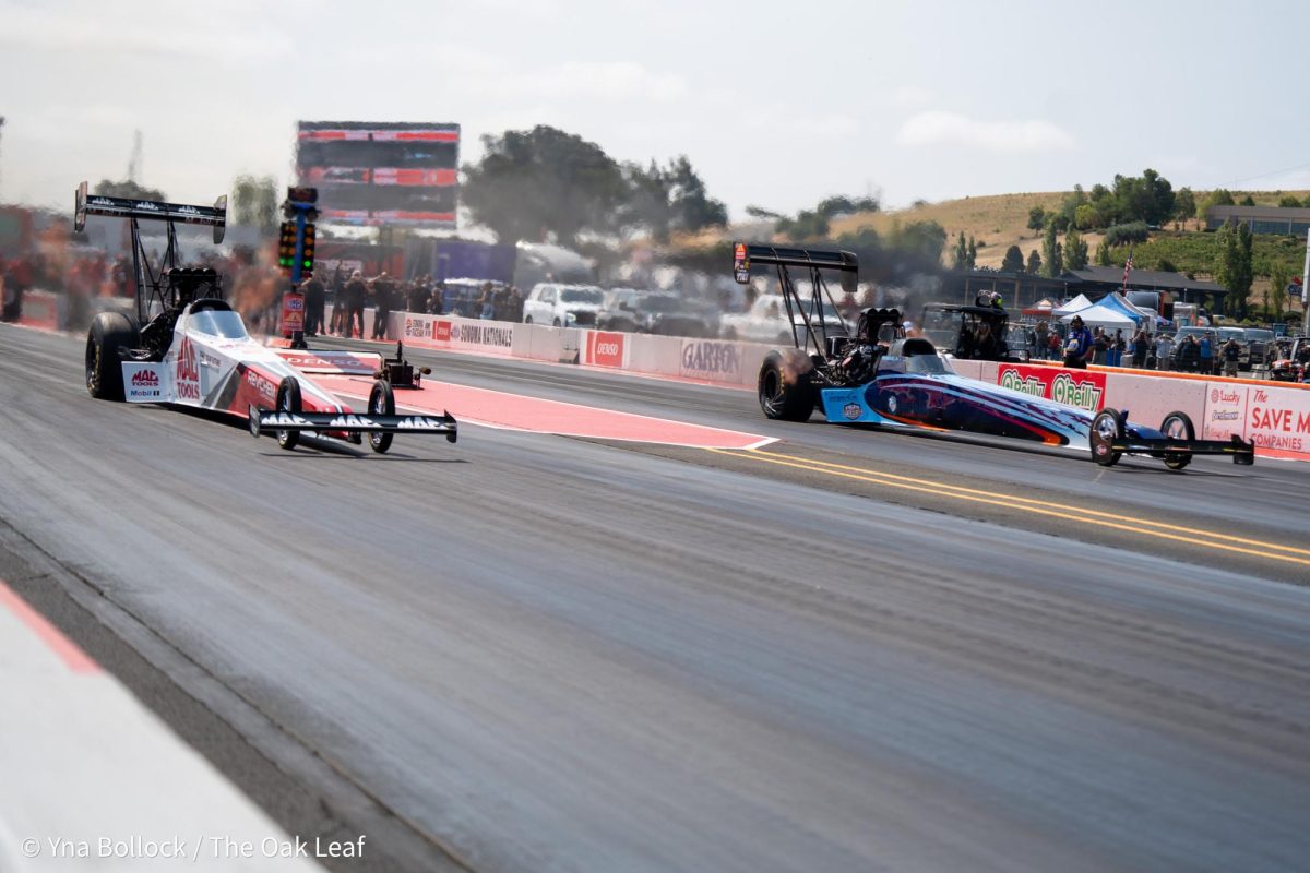 Top Fuel driver Ron August Jr (right) wins the run in the first round eliminations in an upset over Doug Kalitta (left) at the DENSO NHRA Sonoma Nationals on Sunday, July 28, 2024 in Sonoma. 