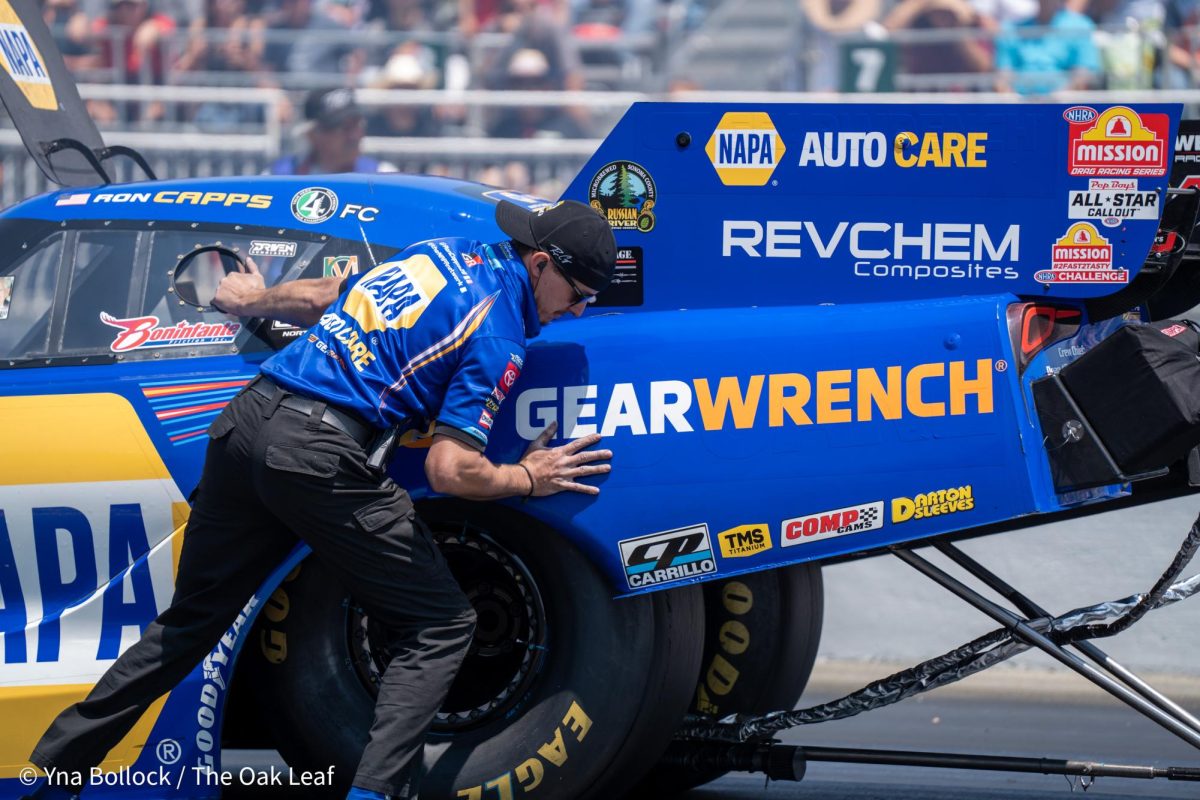 Funny Car driver Ron Capps is pushed back to the starting line by a member of his crew for the second round of eliminations at the DENSO NHRA Sonoma Nationals on Sunday, July 28, 2024 in Sonoma. 