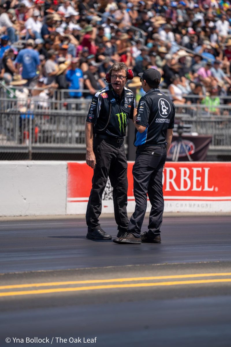 Crew members assess the track for the final round of Top Fuel qualifiers at the DENSO NHRA Sonoma Nationals on Sunday, July 28, 2024 in Sonoma.