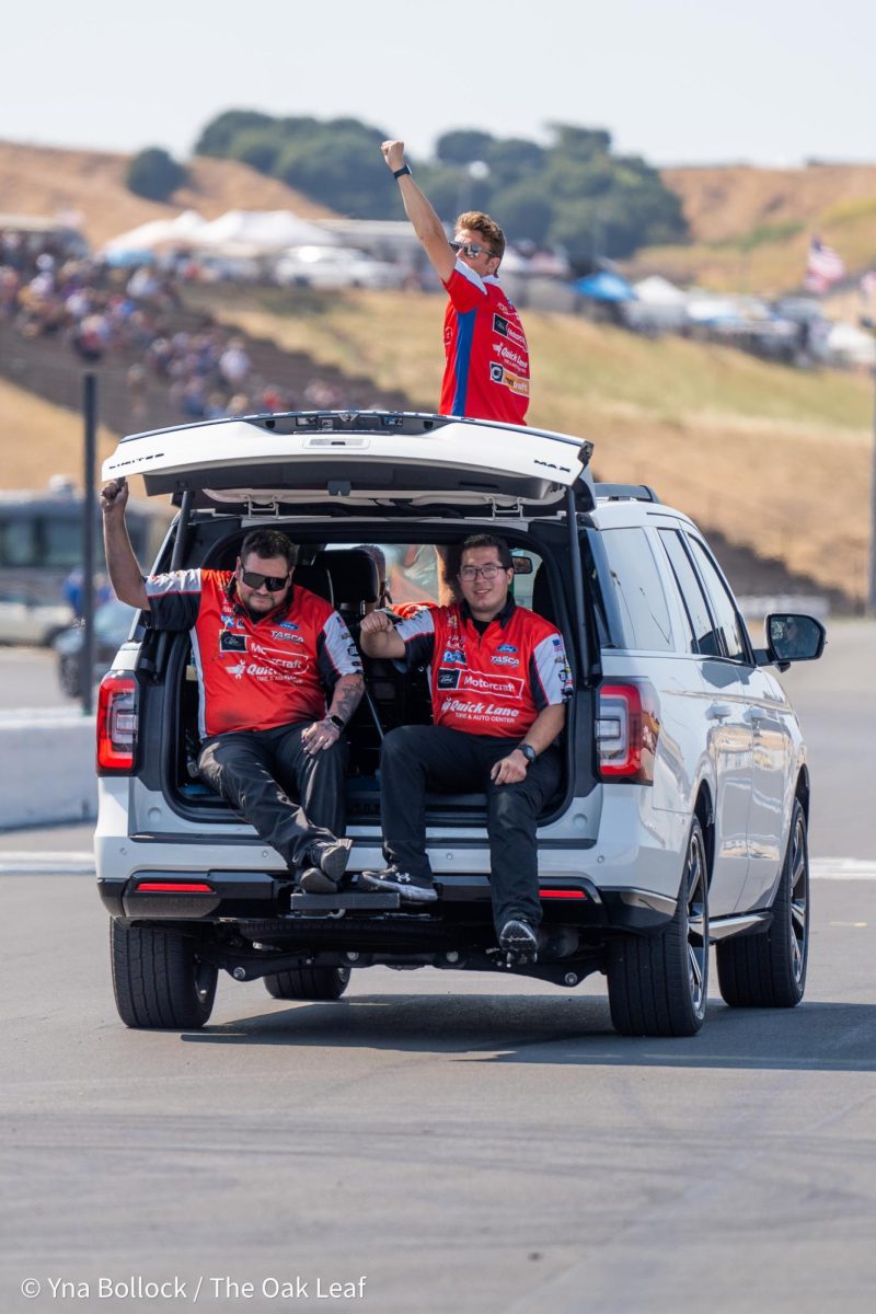 Crew and family members take a victory drive towards Top Fuel driver Bob Tasca III after he wins in his category at the DENSO NHRA Sonoma Nationals on Sunday, July 28, 2024 in Sonoma. 