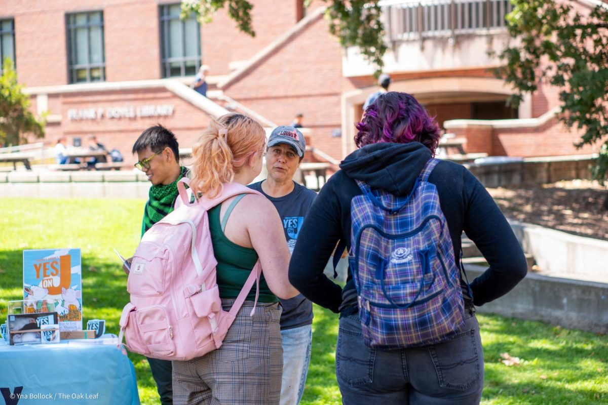 Organizer Carla Cabral present their case for "Yes on J" to SRJC students in the quad on Thursday, August 22, 2024 in Santa Rosa.