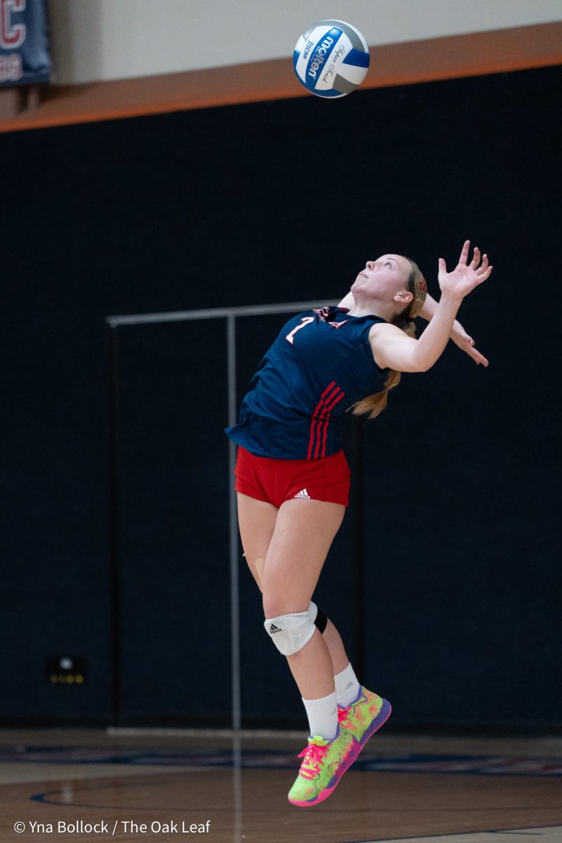 Defensive specialist Jaiden Brooner winds back to serve the ball against Folsom Lake on Friday, September 27, 2024. 