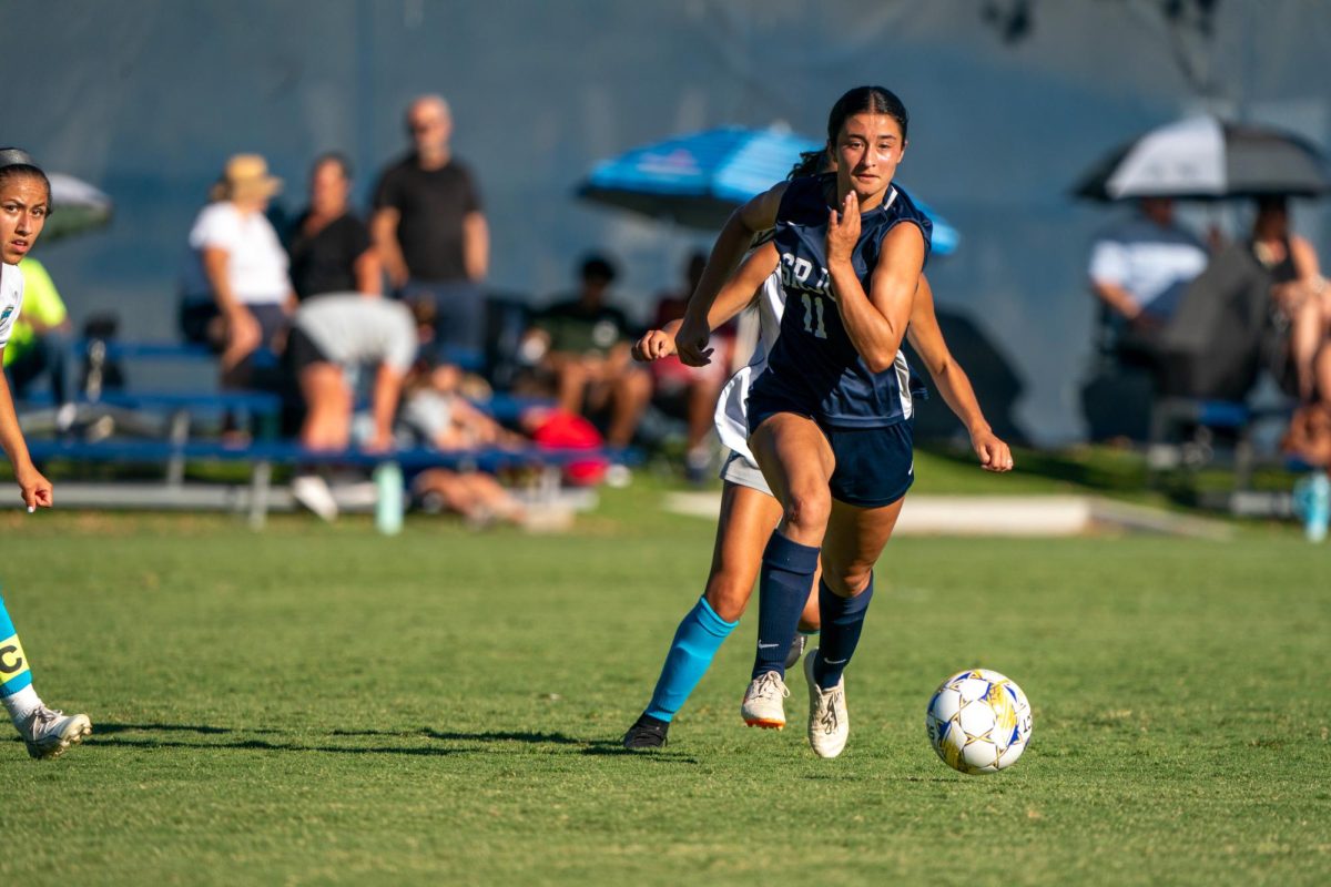 Midfielder Mia Carra takes hold of the ball and heads towards the goal at home against Clovis Community College on Thursday, September 6, 2024.