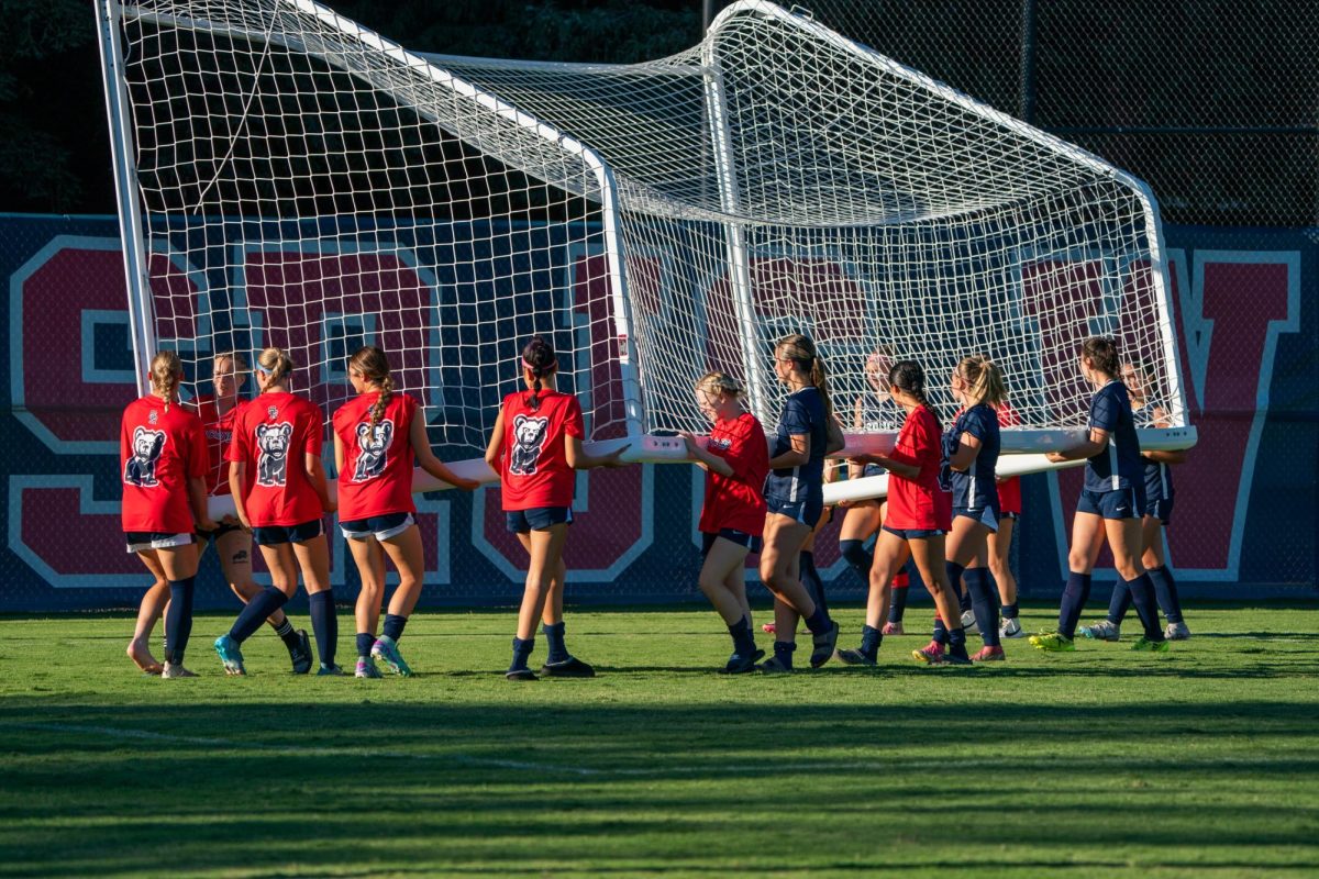 Members of the SRJC Women's Soccer team lift the goal together effortlessly at the conclusion of their game at home against Clovis Community College on Thursday, September 6, 2024.