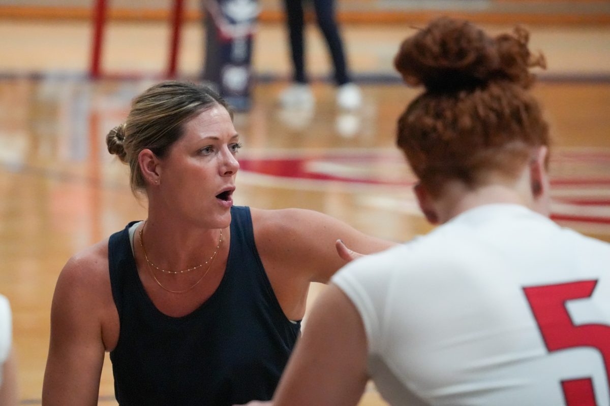 Santa Rosa’s head coach Ally Sather speaks to her team during a timeout against Folsom Lake on Friday, September 27, 2024.