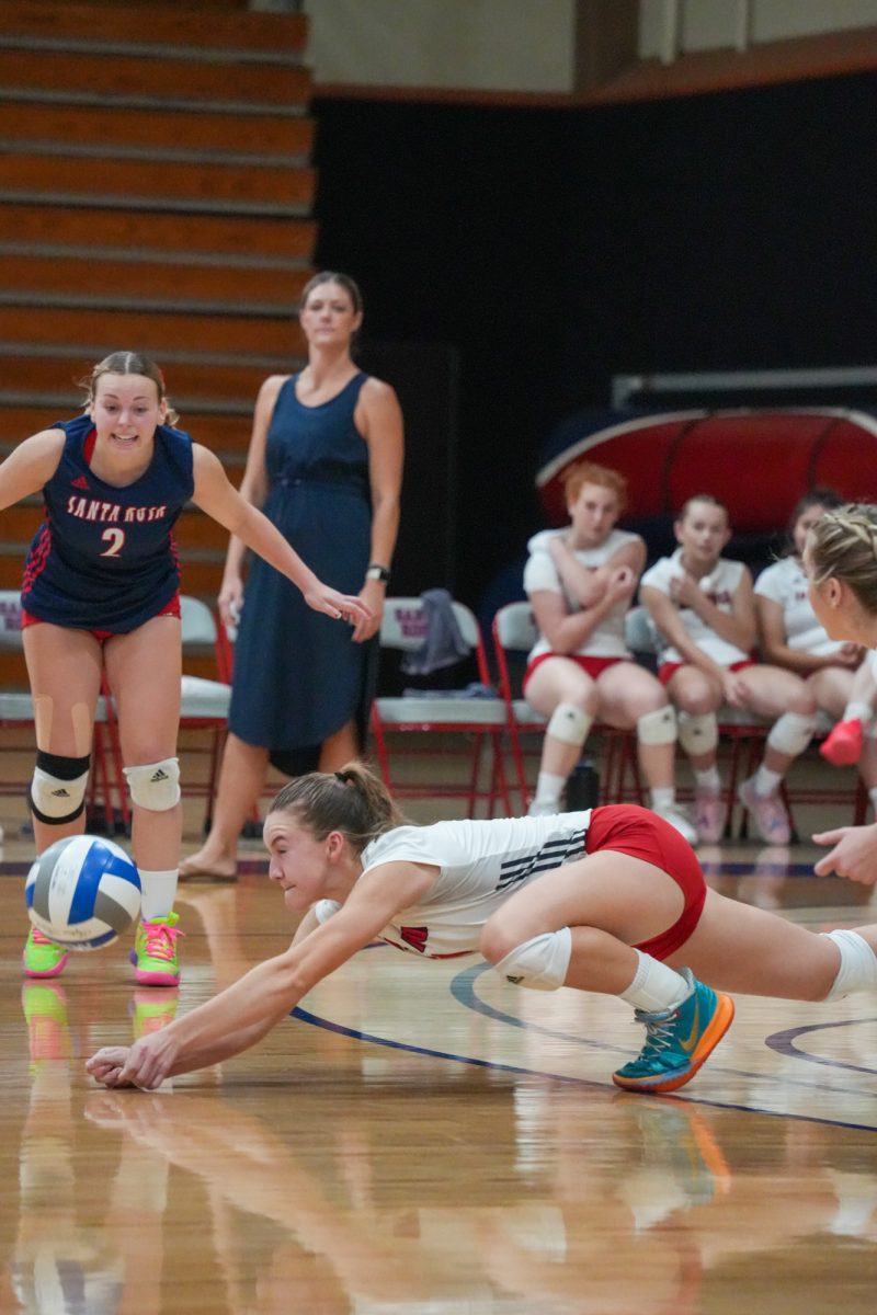 Bear Cubs outsider hitter Madison Shaw drops low for a dig, keeping the ball in play against Folsom Lake on Friday, September 27, 2024.