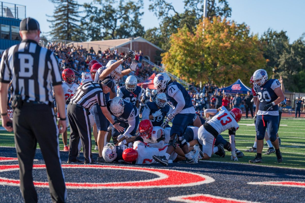 Runningback Damian Escarcega secures the first touchdown after a 2 yard run into the endzone in the first quarter at Santa Rosa's Bailey Field on Saturday, September 7, 2024.