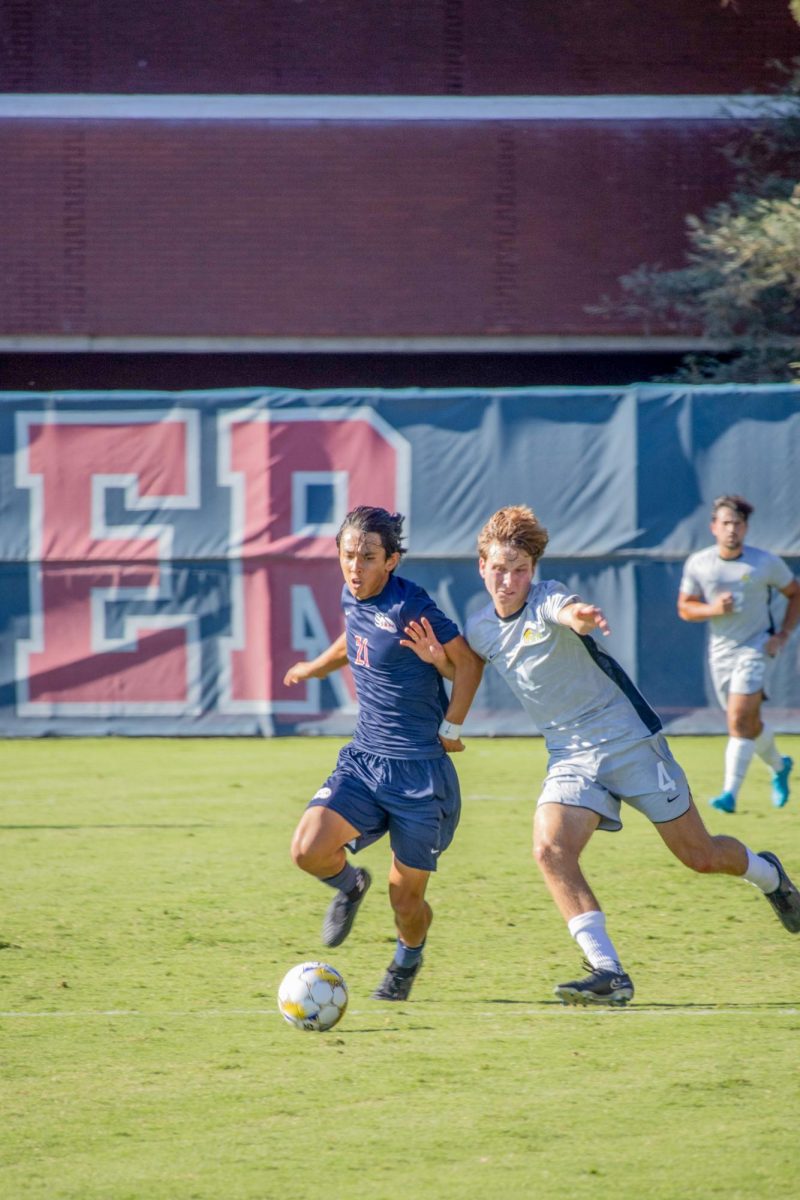 Midfielder Jaxon Cho gets tangled against Cañada's Francesco Lipparoni at home on Tuesday, September 10, 2024.