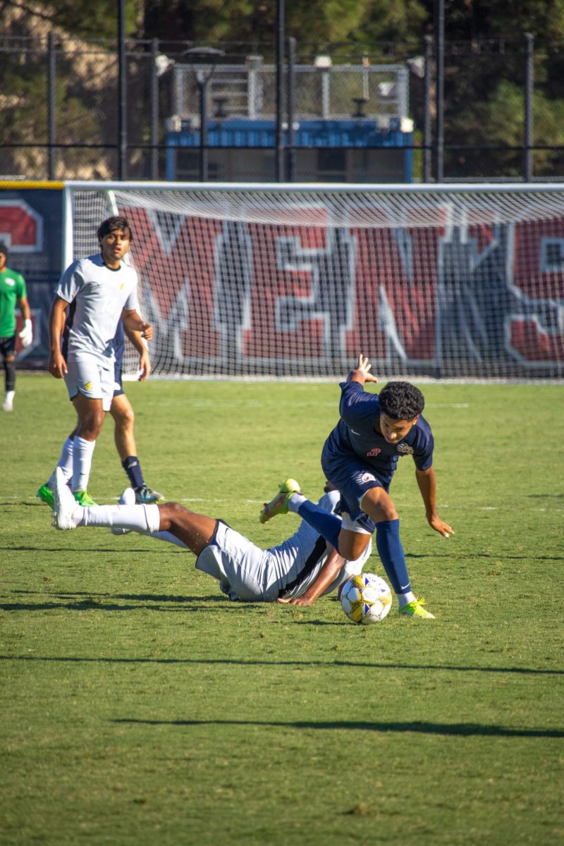 Defender Raffino Landford runs down the left flank and over a mowed down player from Cañada at home on Tuesday, September 10, 2024.
