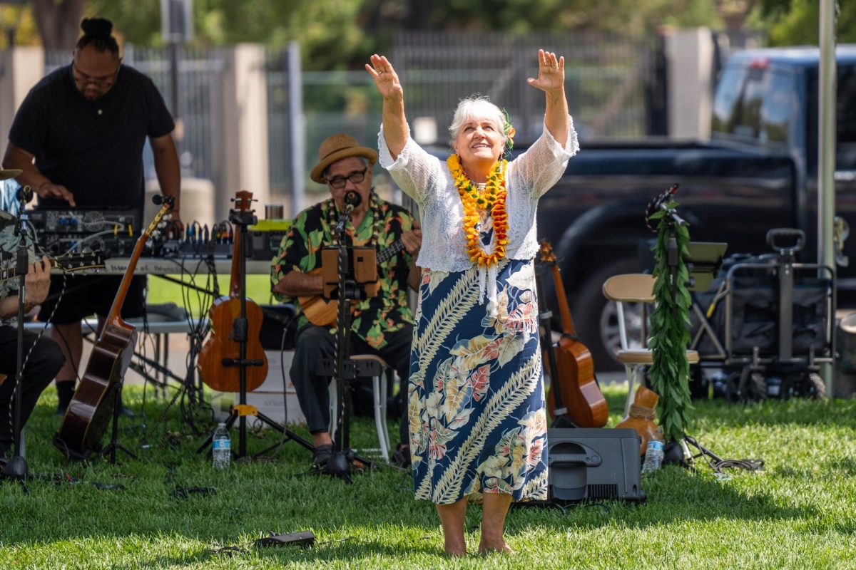 A member of the Maile Swing Band accompanies the band with a gentle dance at the Pacific Islander Festival in Rohnert Park on August 24, 2024.