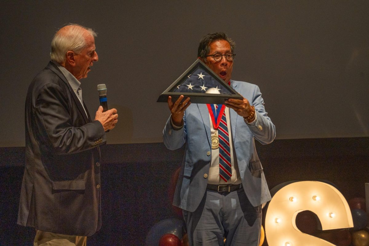 California’s 4th District Rep. Mike Thompson presents Dr. Frank Chong with a flag flown in his honor at the Capitol at the inaugural President's Address in Burbank Auditorium on Thursday, Sept. 5, 2024.