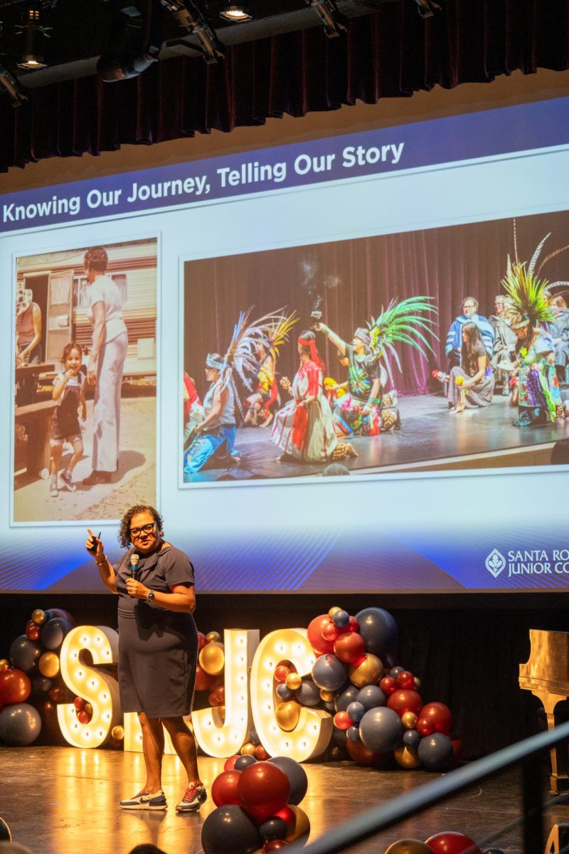 SRJC President and Superintendent Dr. Angélica Garcia reflects on the pictures displayed during her address in Burbank Auditorium on Thursday, Sept. 5, 2024.