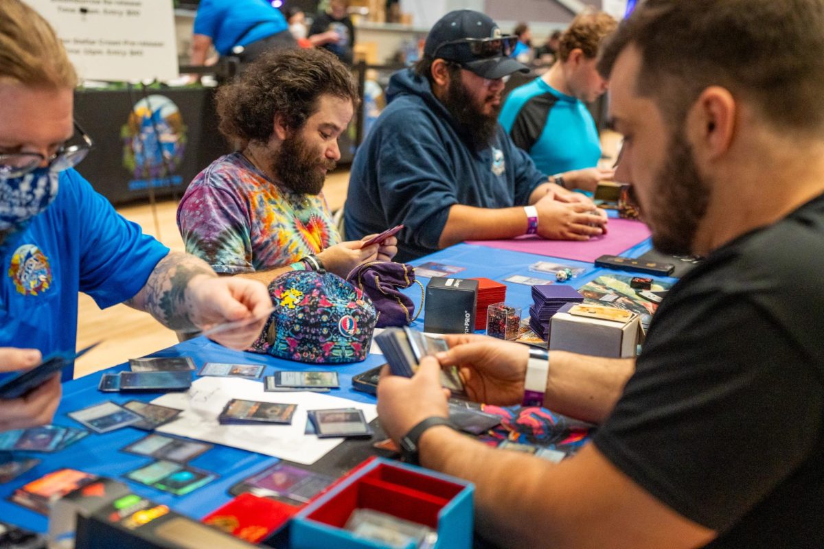 Participants prepare their decks for inspection for the "Magic: The Gathering" tournament at Sonoma Con in Santa Rosa on Saturday, August 31, 2024.