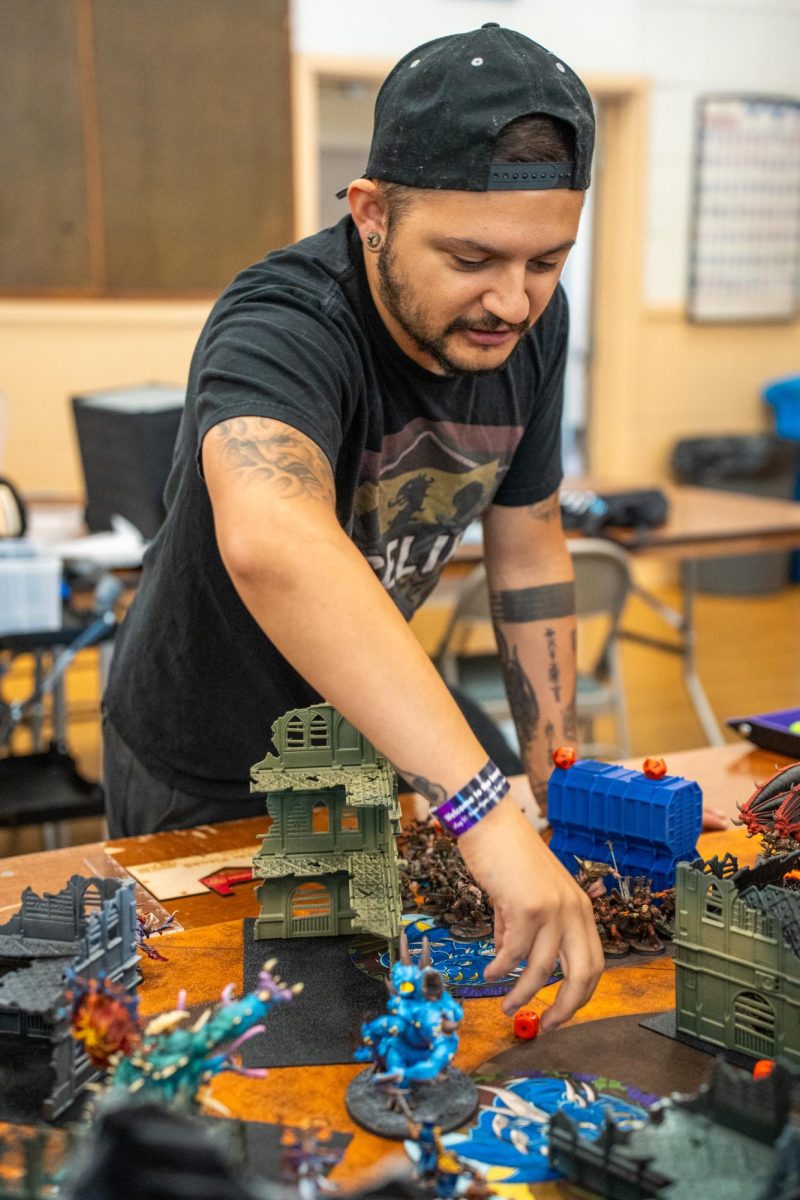 A participant for the "Warhammer 40k" tournament prepares to take their turn at Sonoma Con in Santa Rosa on Saturday, August 31, 2024.