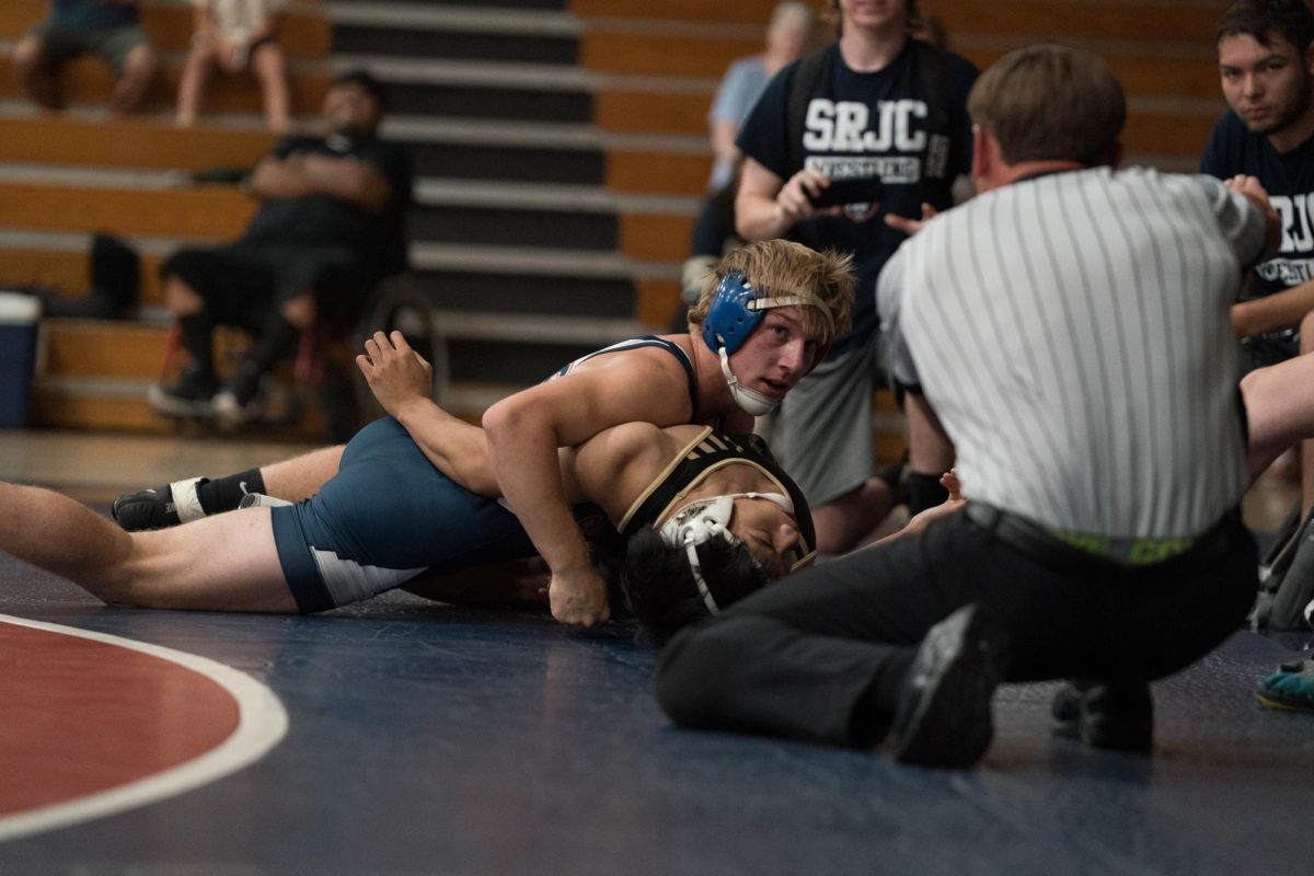 Talon Pleau pins his opponent from Delta during a match in Haehl Pavilion on September 14, 2024.