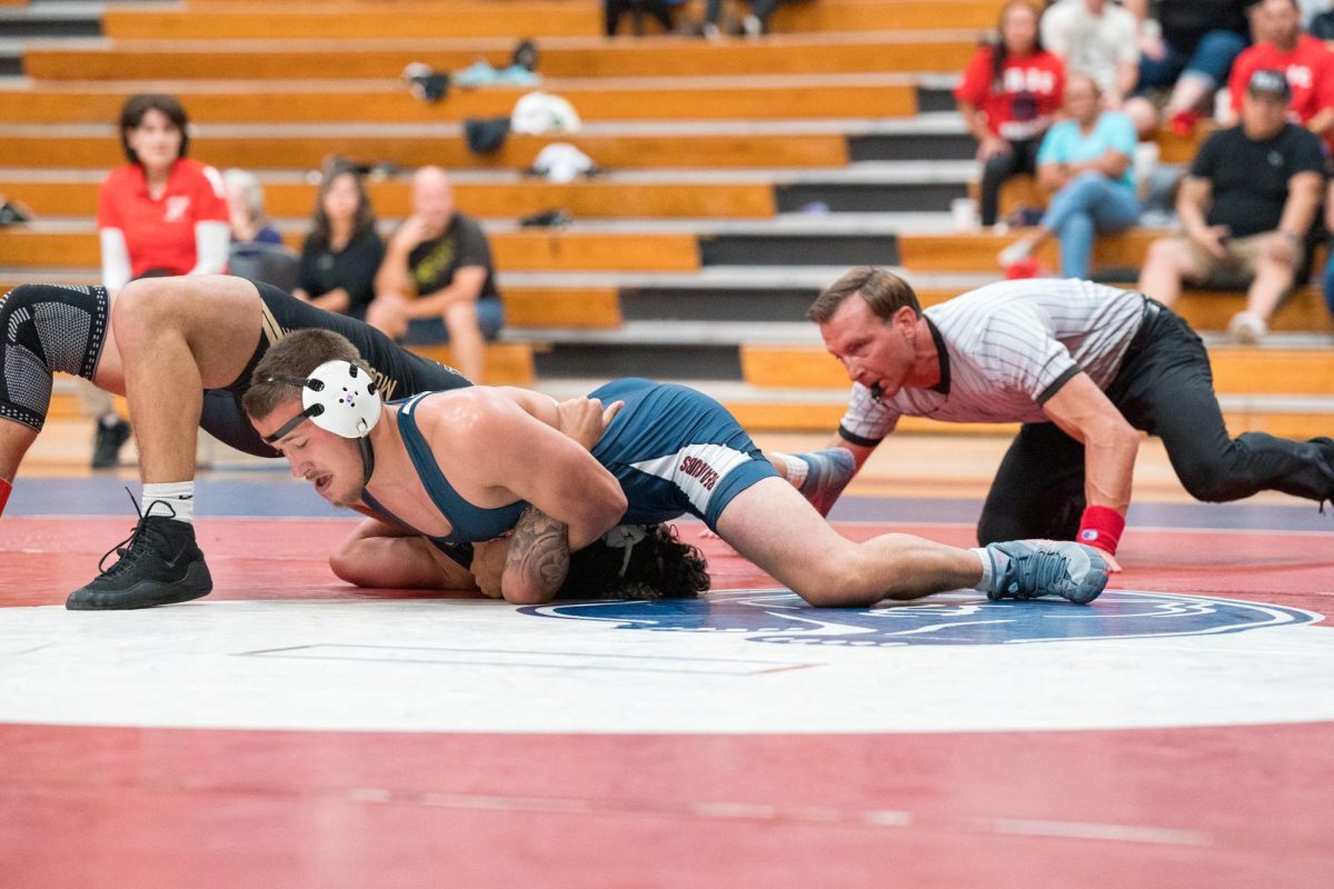 Zackary Morgan pins his opponent down in a match against Delta in Haehl Pavilion on September 14, 2024.