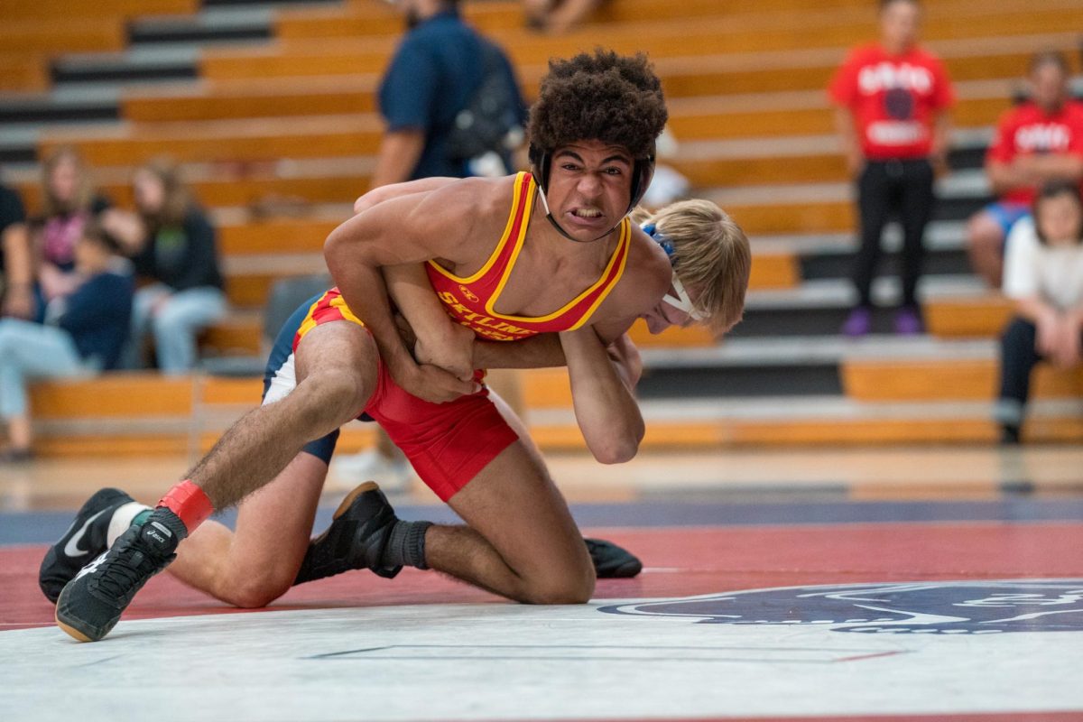 Talon Pleau secures his grip while his opponent struggles during the match at Haehl Pavilion on September 14, 2024.