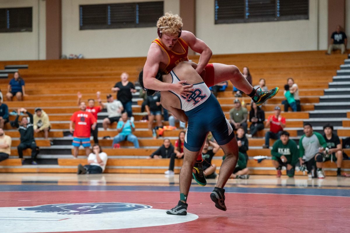 Amrit Cheema heaves the Skyline College wrestler onto the mat during his match at Haehl Pavilion on September 14, 2024.