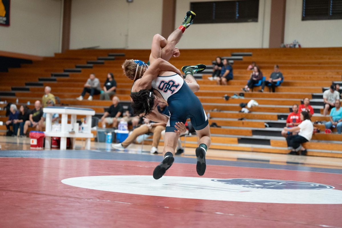 Talon Pleau drives his opponent into the mat at Haehl Pavilion on September 14, 2023