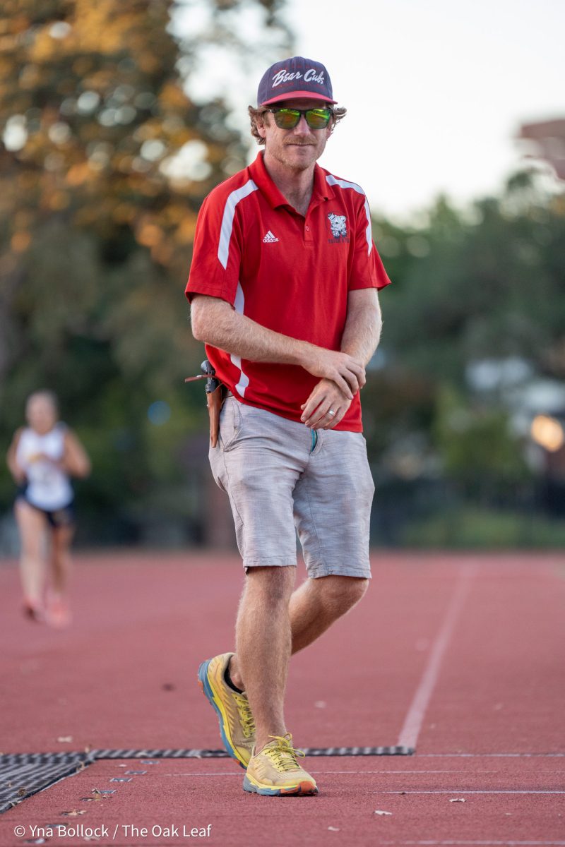 Santa Rosa head coach David Wellman walks back to the starting line at the Kyle Robinson Invitational at home on Friday, Sept. 27, 2024.