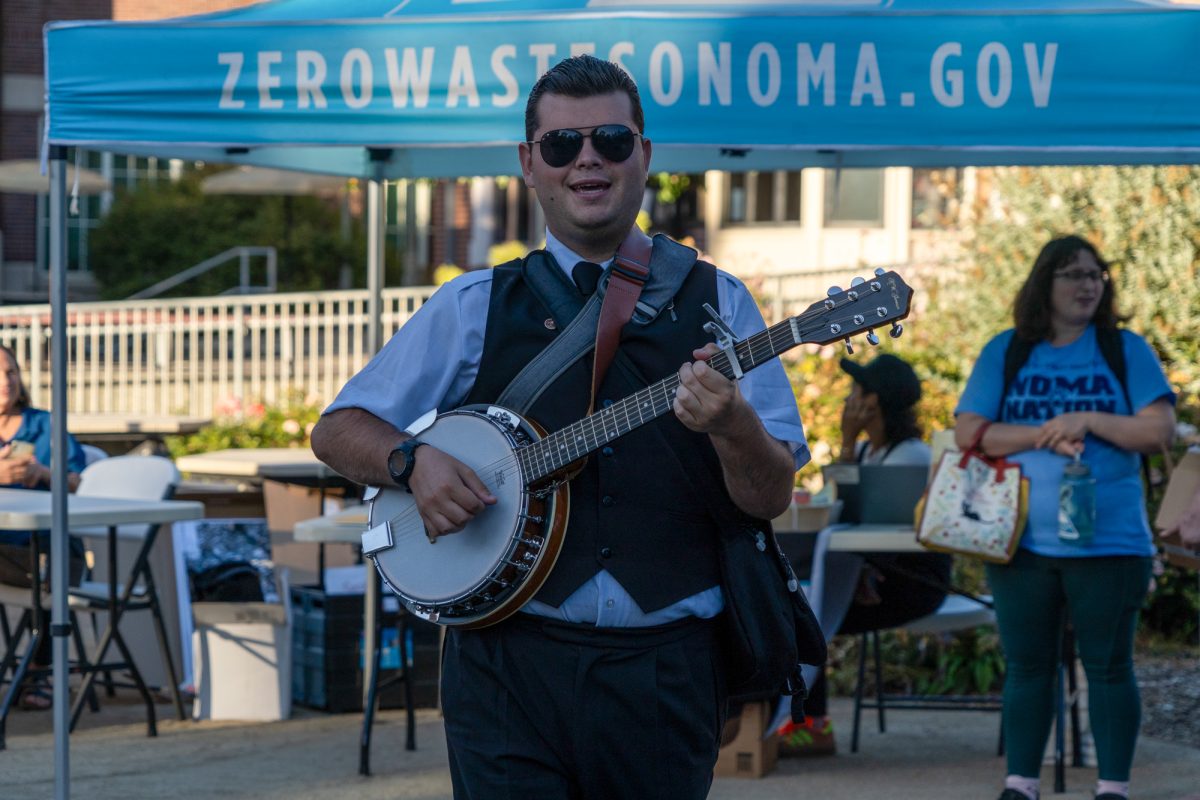 Sam Breall performs with  a banjo during the Green Living Fair in the Bertolini Quad on the Santa Rosa campus on Thursday, Oct. 10, 2024.