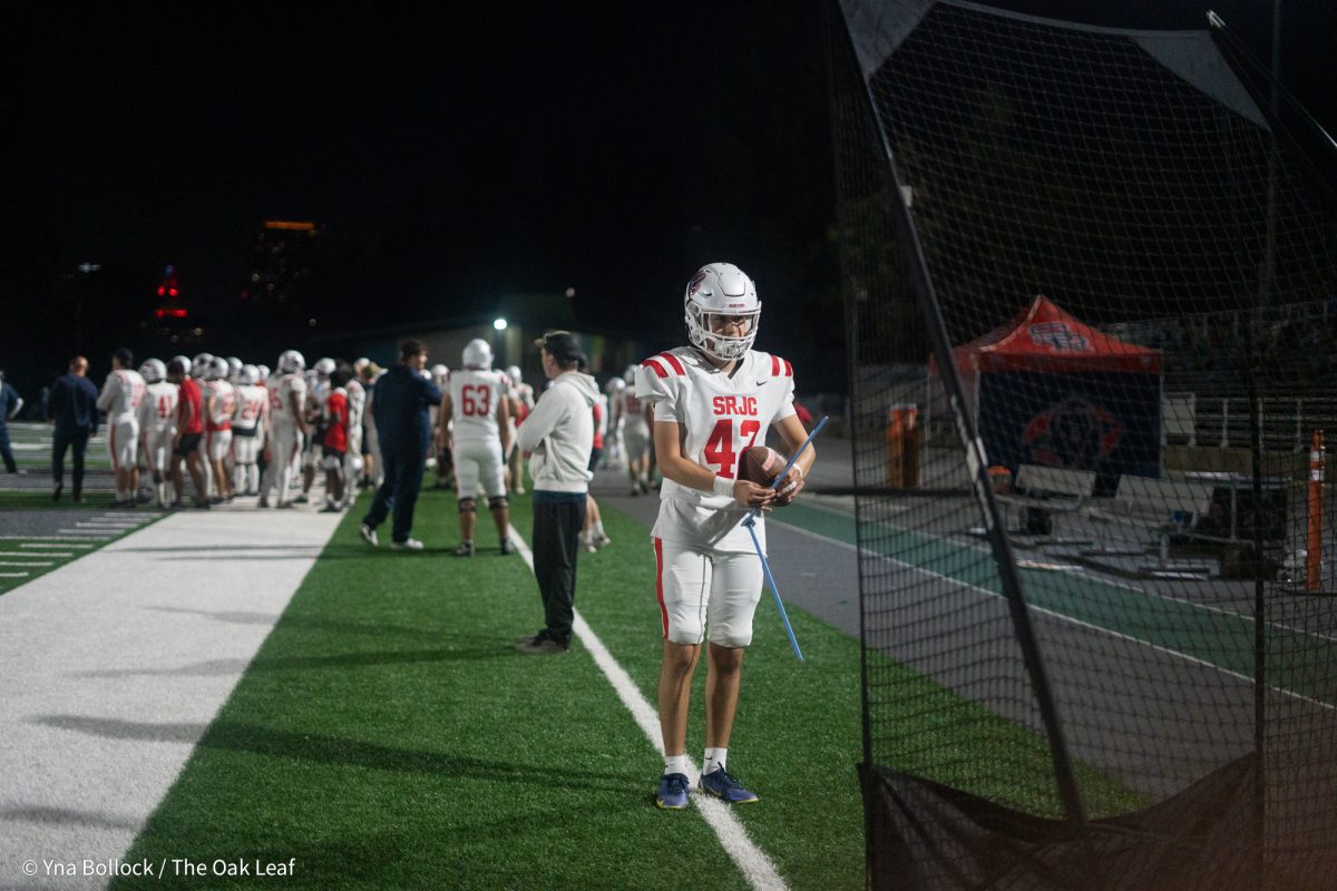 Kicker Julian Valencia prepares on the sidelines during the game against Laney College on Oct. 4, 2024.