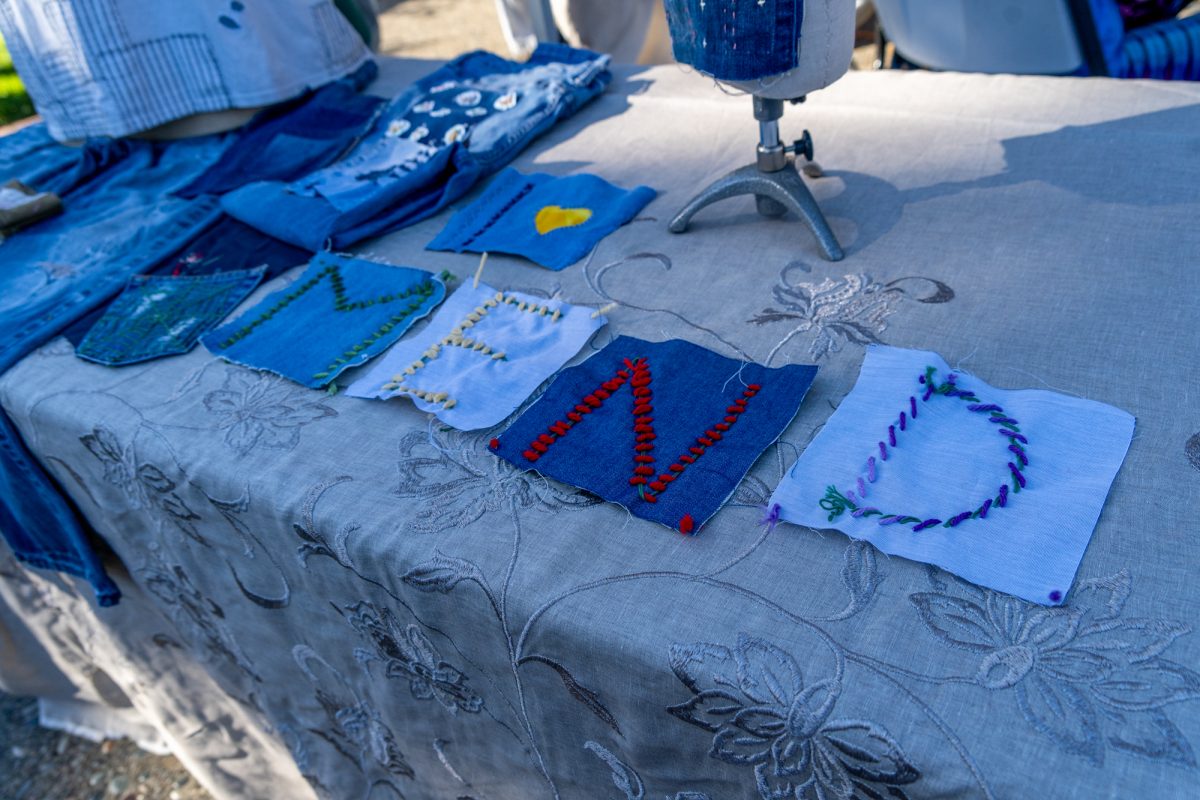 Mended fabrics are displayed by the Fashion Studies booth at the Green Living Fair in the Bertolini Quad on the Santa Rosa campus on Thursday, Oct. 10, 2024.