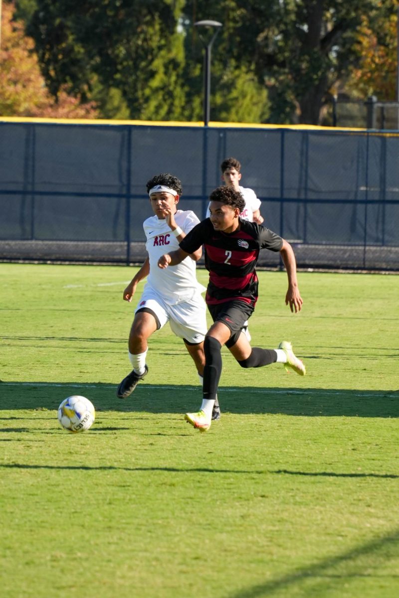 Santa Rosa’s defender Xavius Landford carries the ball into attack against American River on Tuesday, Oct. 1, 2024