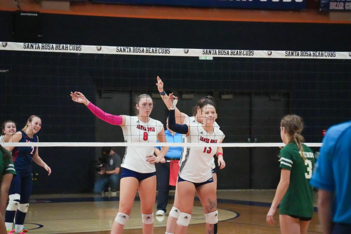 Santa Rosa’s outside hitter Katie Brenninger and middle blocker Sarah Thornton prepare for an upcoming rally against Diablo Valley College at Haehl Pavilion on Oct. 9, 2024. 