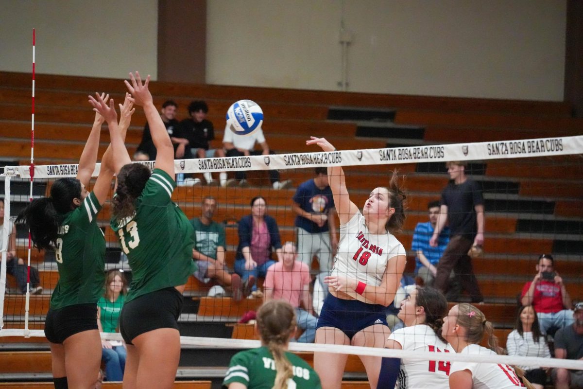 Santa Rosa’s middle/opposite Luka Amand attacks the ball against Diablo Valley College at Haehl Pavilion on Oct. 9, 2024. 