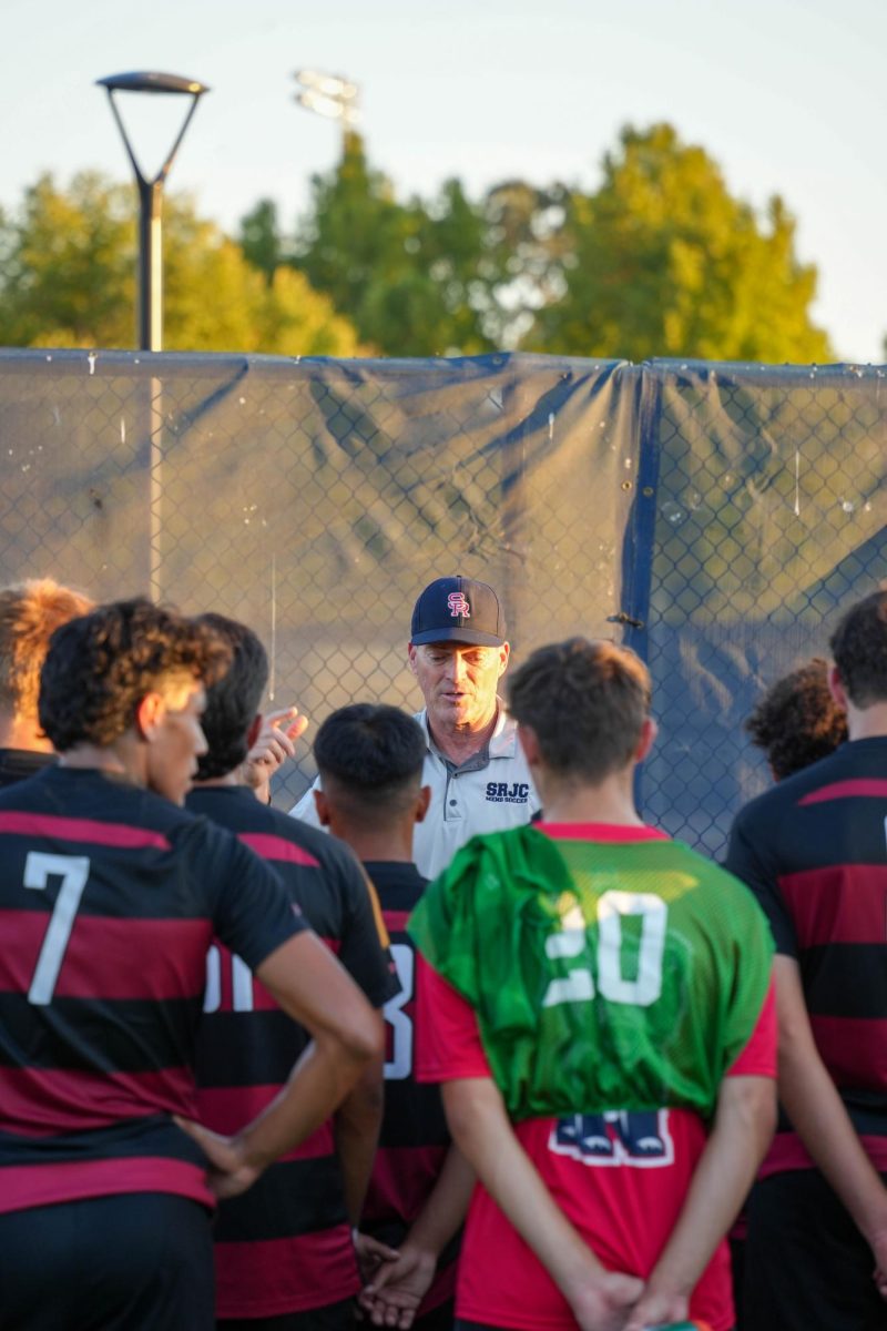 Santa Rosa’s head coach Marty Kinahan speaks to his players following an emphatic win against American River on Tuesday, Oct. 1, 2024 