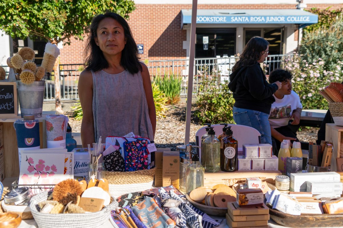 Kim Neal represents the Sonoma County Trading Company's Zero Waste Shop & Refillery at the Green Living Fair in the Bertolini Quad on the Santa Rosa campus on Thursday, Oct. 10, 2024.