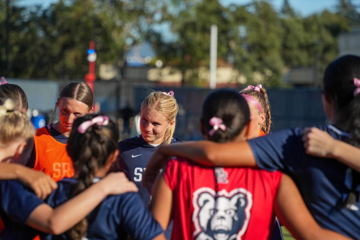 Santa Rosa’s forward Katie Curran is thoughtful during a huddle before the second half against American River College on Tuesday, Oct. 15, 2024.