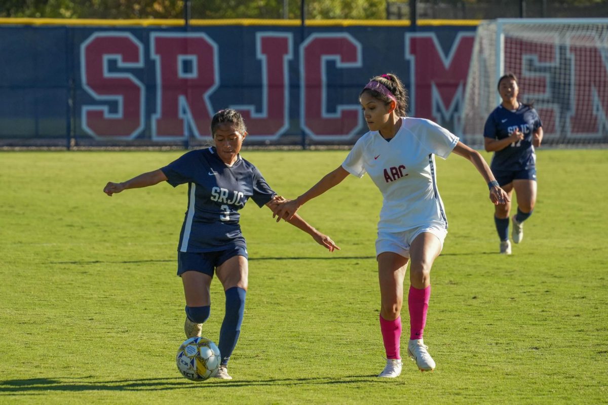 Santa Rosa’s forward Caty Feibusch runs down the wing and fends off an American River defender on Tuesday, Oct. 15, 2024. 