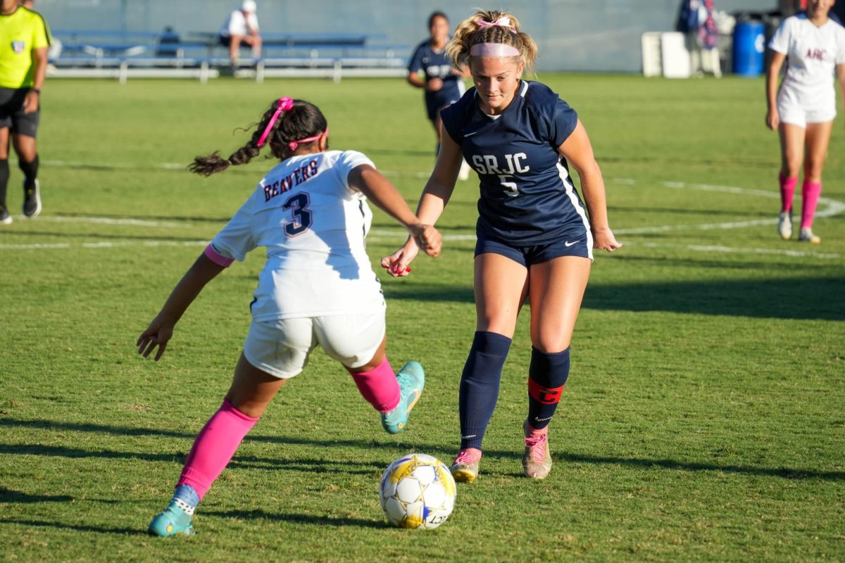 Santa Rosa’s forward Genevieve Stewart defends against American River’s defender Ashley Guerrero-Orozco on Tuesday, Oct. 15, 2024. 